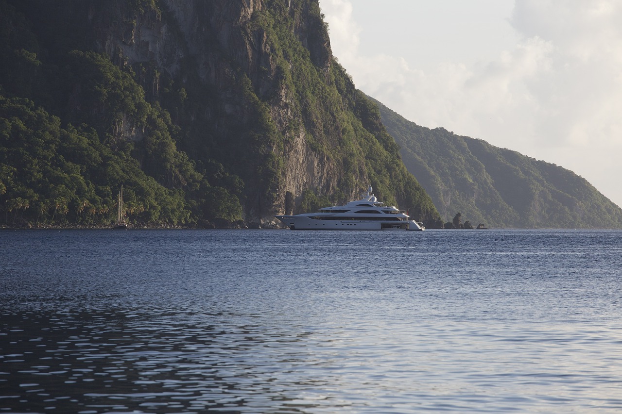 Large yacht anchored near a mountain in the Caribbean